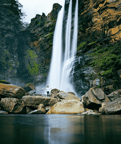 Laxapana Falls in Sri Lanka, a powerful waterfall cascading through lush greenery near the hill country