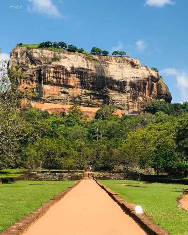 Sigiriya Rock Fortress in Sri Lanka, a UNESCO World Heritage Site surrounded by lush greenery