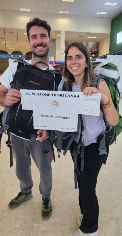 A visitor being warmly welcomed by Aaliya Tours staff at Katunayake Airport in Sri Lanka
